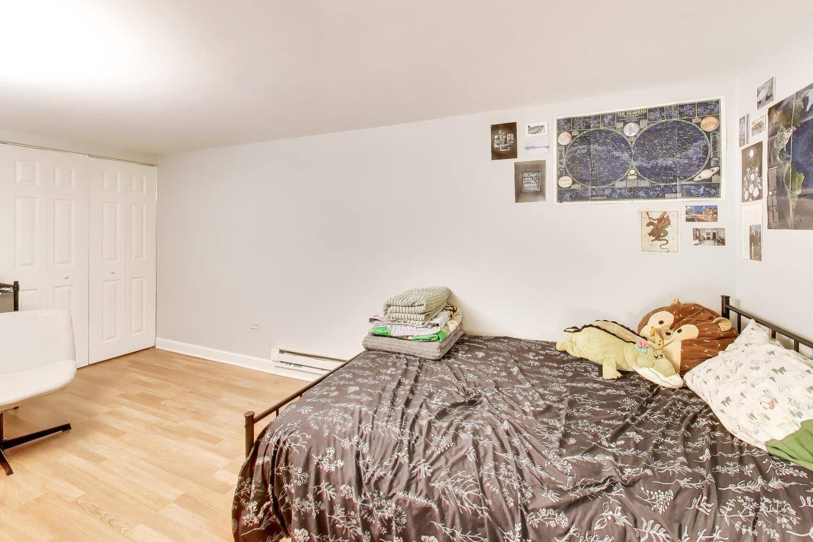 3519 North Seminary Avenue Chicago, IL 60657 - Photo 36 of 43 a bedroom with a bed and painting on the wall