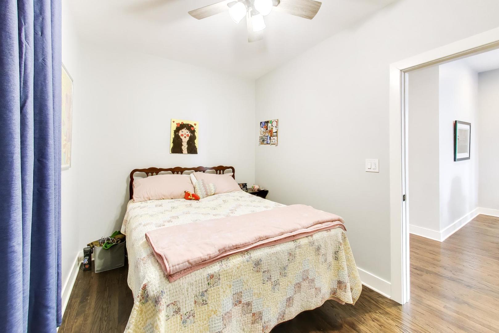 3519 North Seminary Avenue Chicago, IL 60657 - Photo 4 of 43 a bedroom with a bed and wooden floor