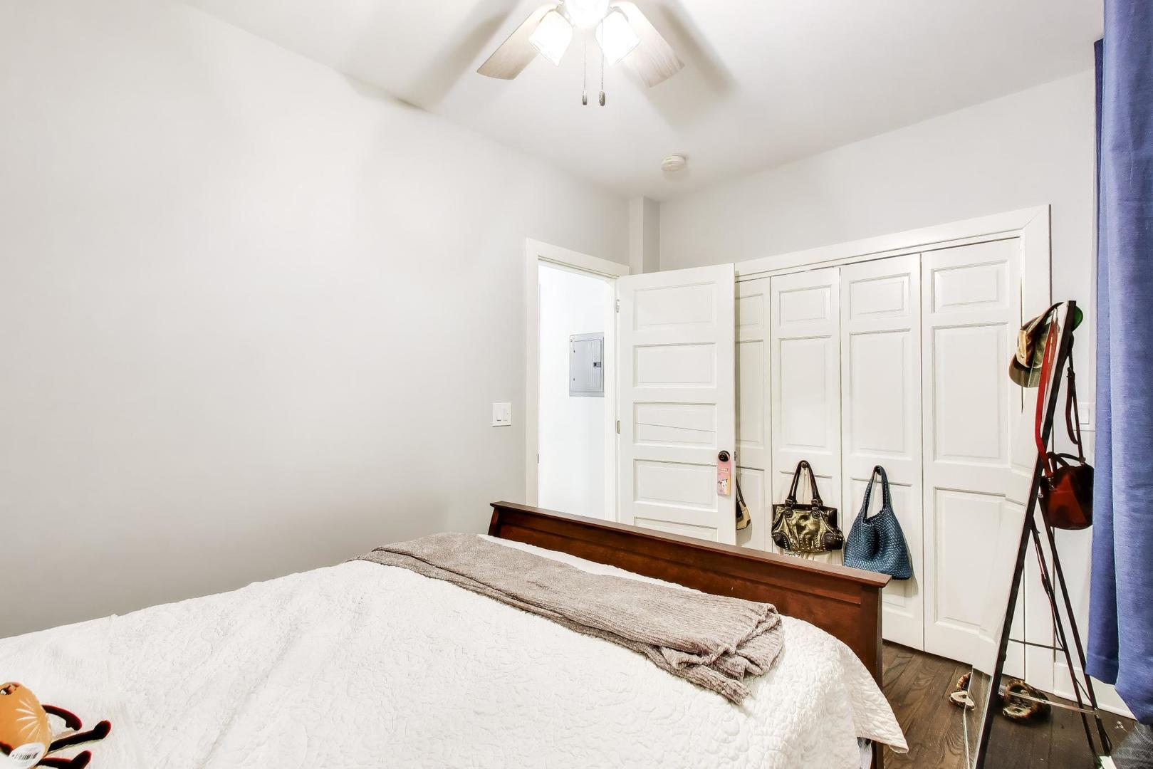 3519 North Seminary Avenue Chicago, IL 60657 - Photo 7 of 43 a bedroom with a bed and a chandelier