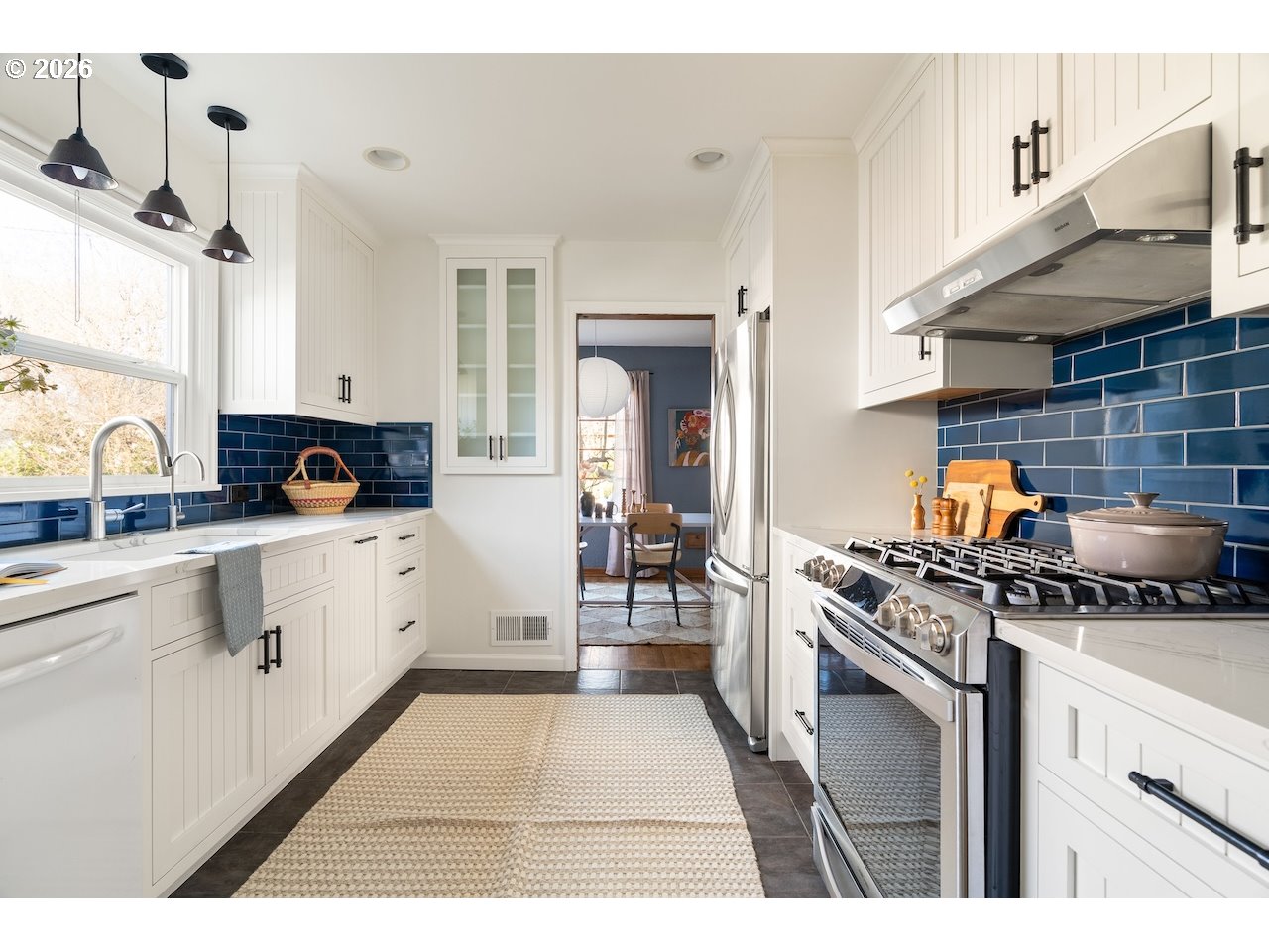 1606 North Alberta Street Portland, OR 97217 - Photo 14 of 46 a kitchen with a stove and white cabinets
