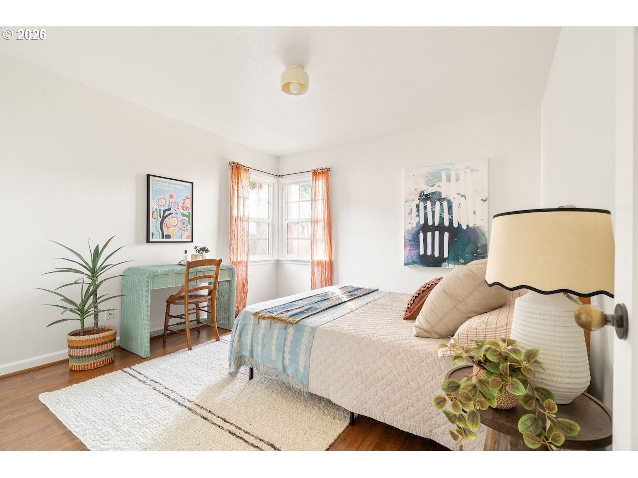 1606 North Alberta Street Portland, OR 97217 - Photo 17 of 46 a bedroom with a bed and wooden floor