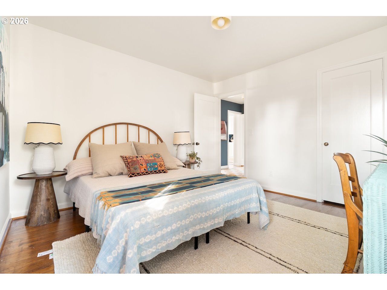 1606 North Alberta Street Portland, OR 97217 - Photo 18 of 46 a bedroom with a bed a table and chair