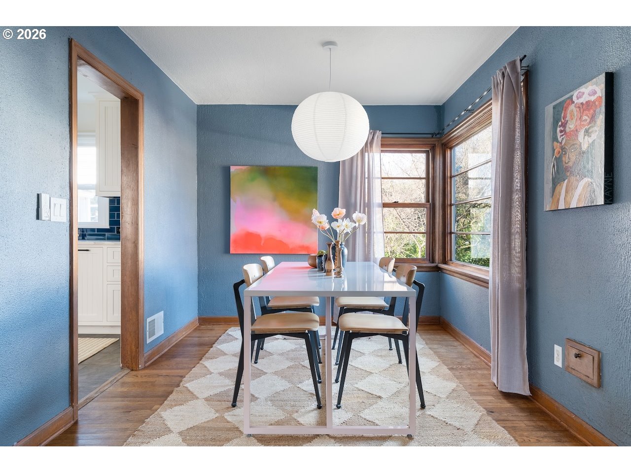 1606 North Alberta Street Portland, OR 97217 - Photo 7 of 46 a dining room with furniture a chandelier and wooden floor