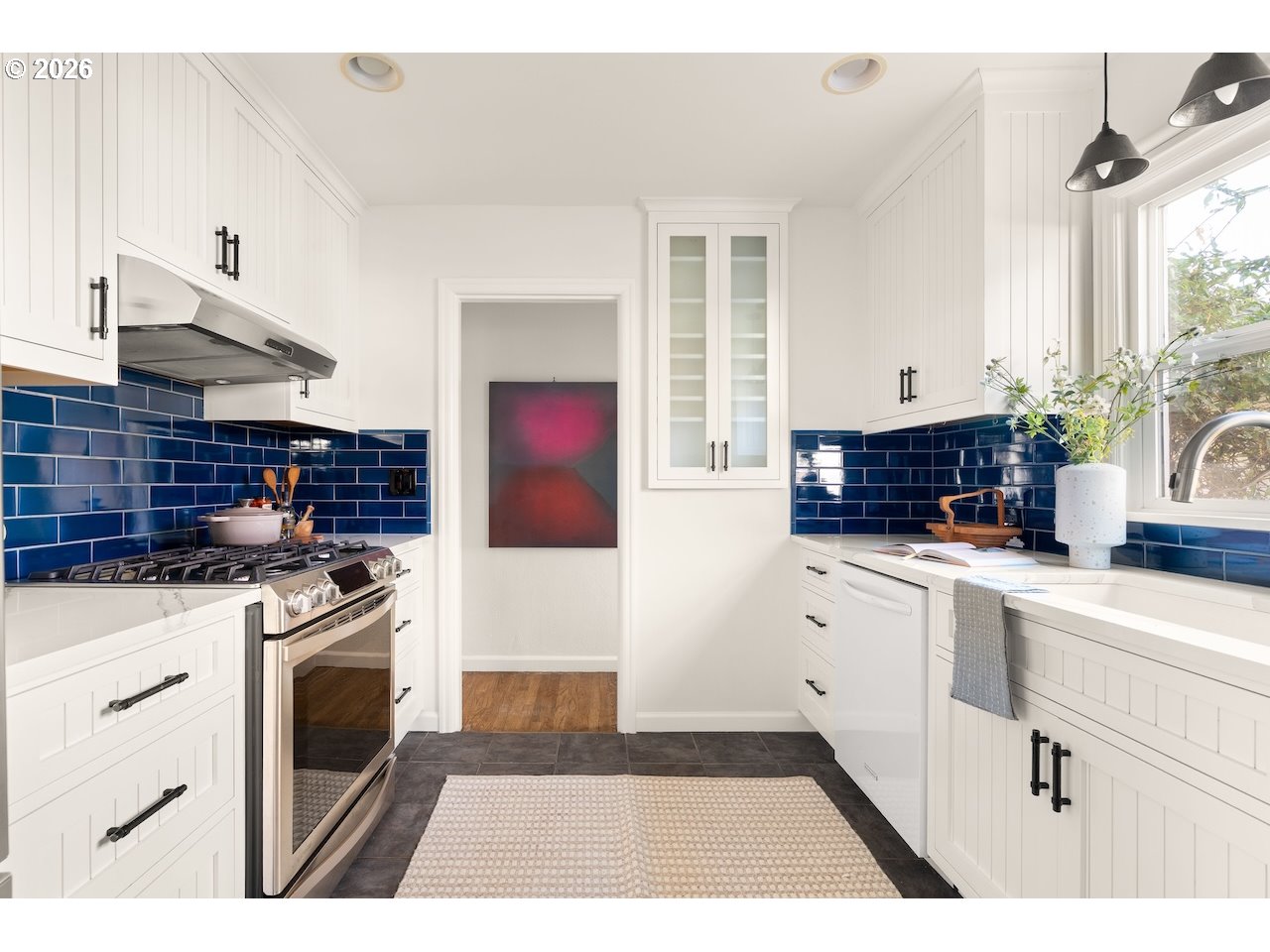1606 North Alberta Street Portland, OR 97217 - Photo 9 of 46 a kitchen with stainless steel appliances granite countertop a stove a sink and a refrigerator