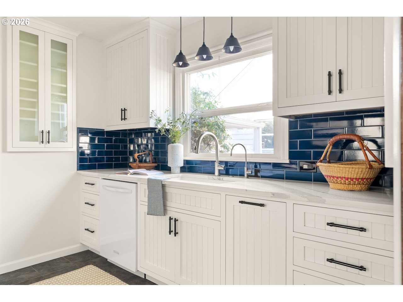 1606 North Alberta Street Portland, OR 97217 - Photo 10 of 46 a kitchen with white cabinets and window