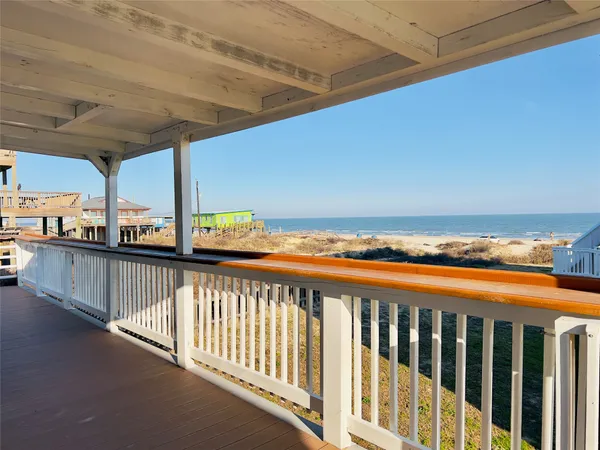 a view of balcony with wooden floor