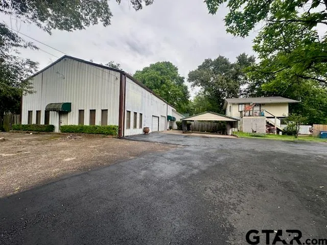 a view of a house with a street