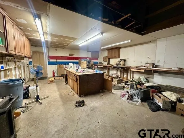 a view of a house with a yard and tree s