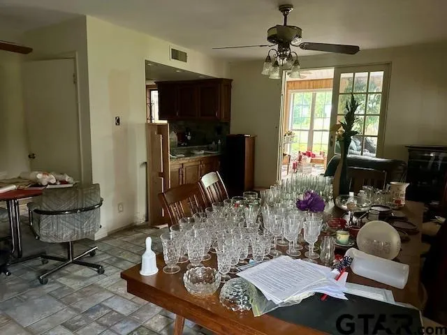 a living room with furniture a window and a chandelier