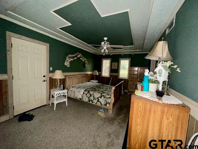 a bedroom with bed and window