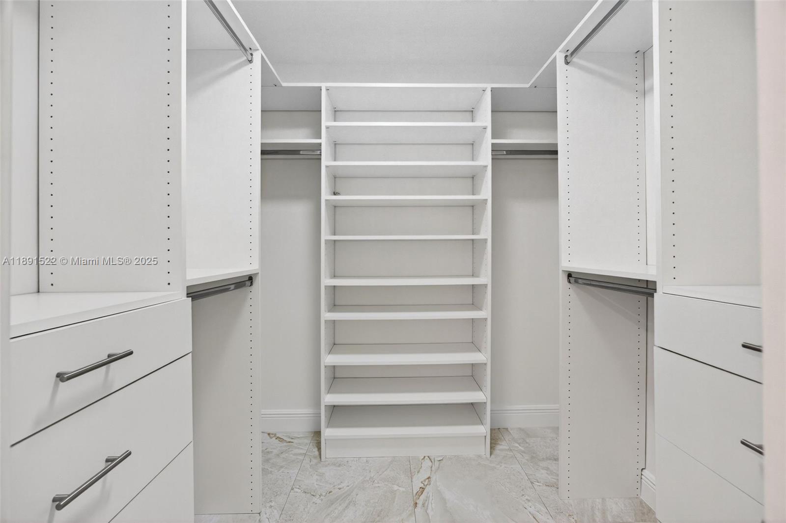 13280 Southwest 39th Terrace Miami, FL 33175 - Photo 21 of 57 a view of walk in closet with empty racks