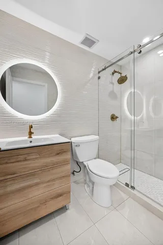 a utility room with sink dryer and washer