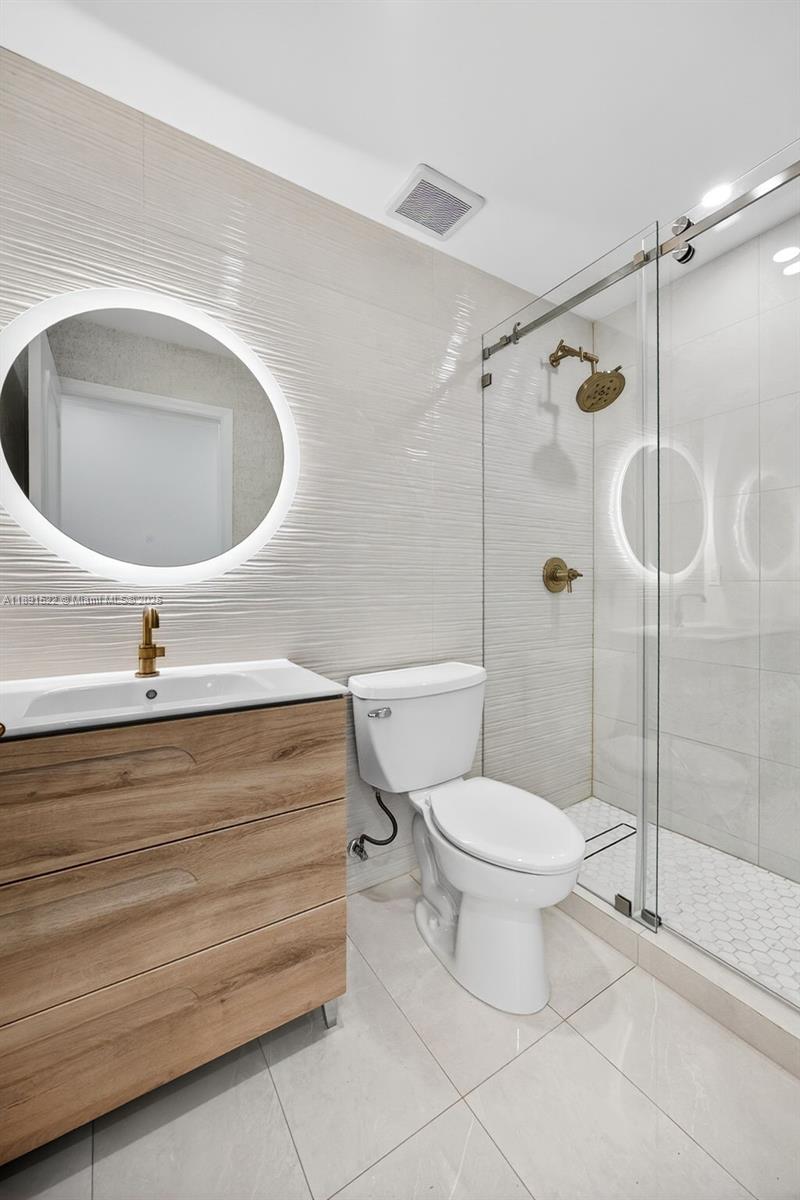 13280 Southwest 39th Terrace Miami, FL 33175 - Photo 30 of 57 a bathroom with a toilet and a sink