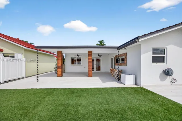 a view of multiple houses with a yard