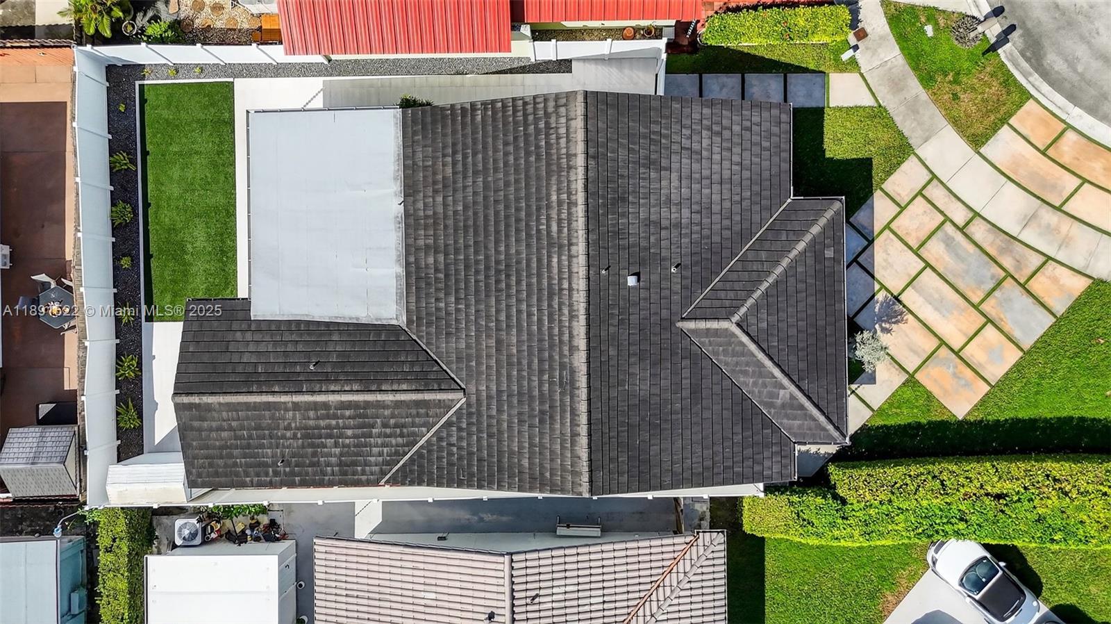 13280 Southwest 39th Terrace Miami, FL 33175 - Photo 51 of 57 a view of a house with a small yard and potted plants