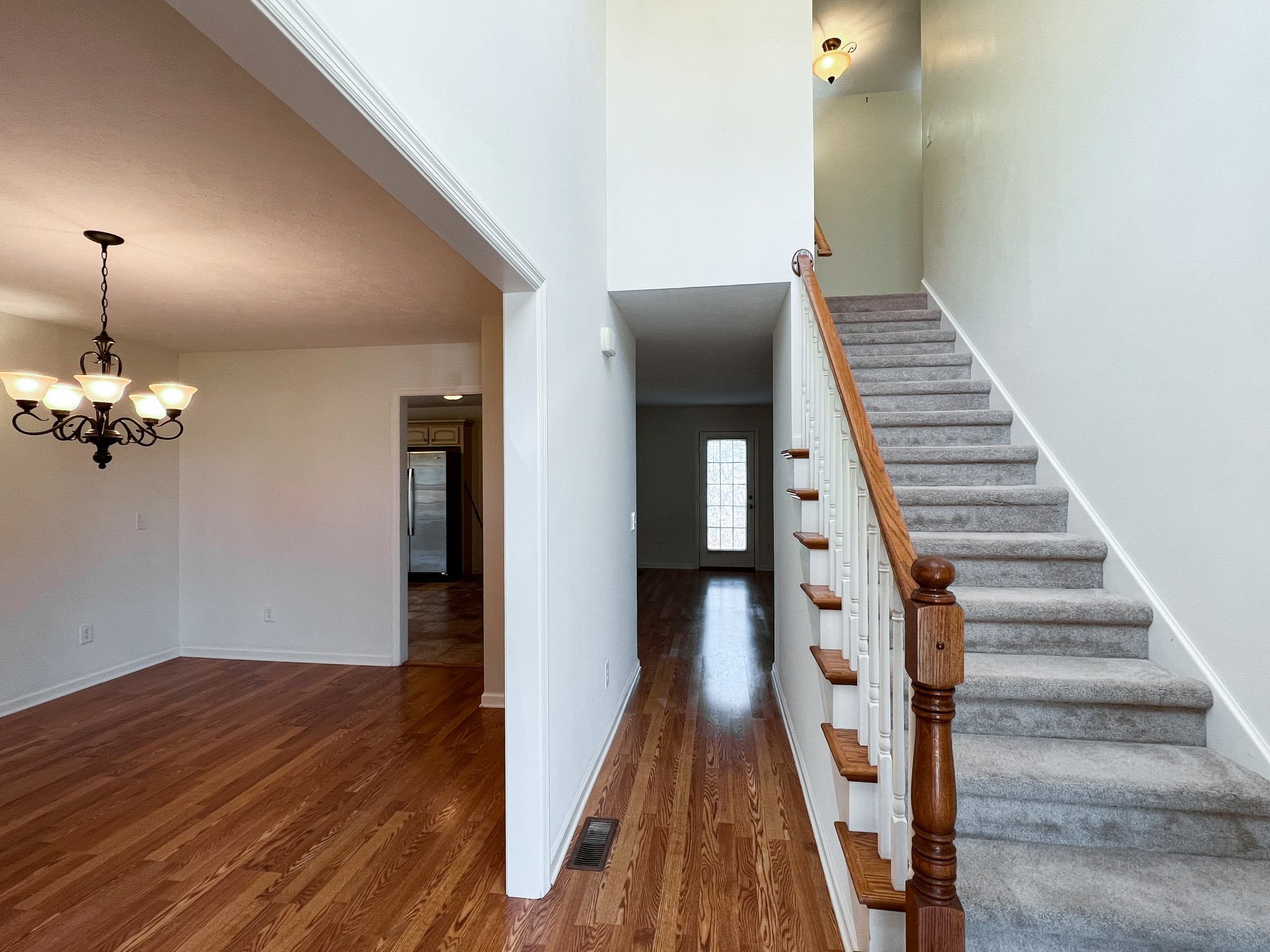 258 Austin Branch Road Portland, TN 37148 - Photo 8 of 41 a view of a hallway with wooden floor and stairs
