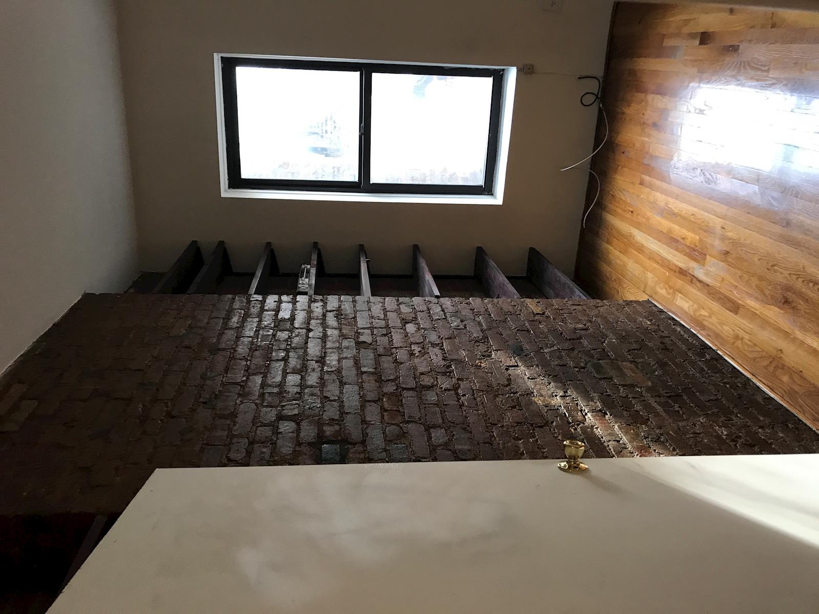 a view of wooden floor in an empty room