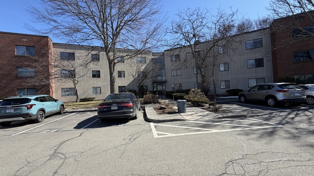 150 Lewis Street, Unit 302 Lynn, MA 01902 - Photo 14 of 18 a car parked in front of a building