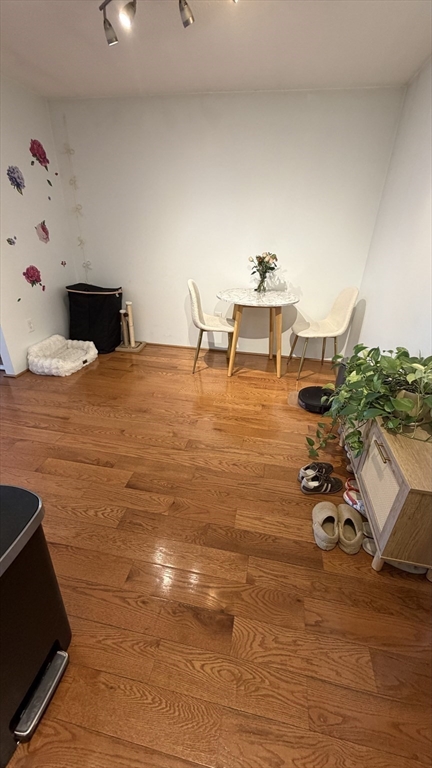 150 Lewis Street, Unit 302 Lynn, MA 01902 - Photo 4 of 18 a room with a table and chairs
