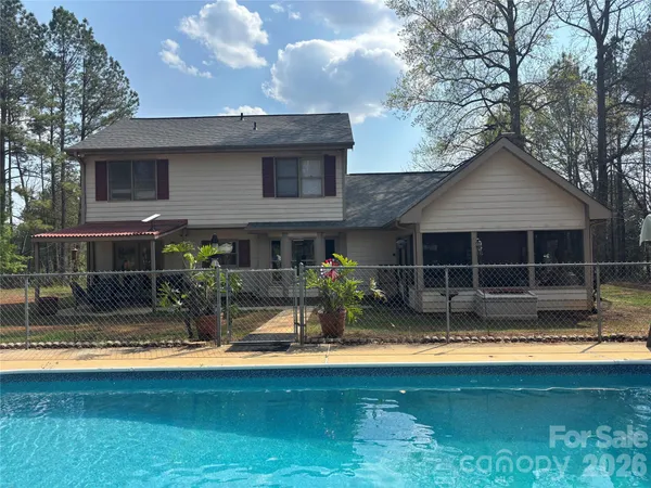 a front view of a house with swimming pool