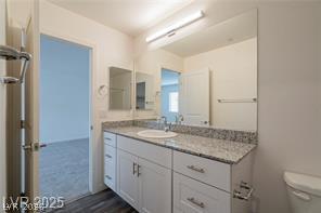 12347 Indigo Montage Road, Unit 3 Las Vegas, NV 89183 - Photo 14 of 23 Gleaming granite counters adorn a bright, spacious vanity in this well-appointed bathroom.