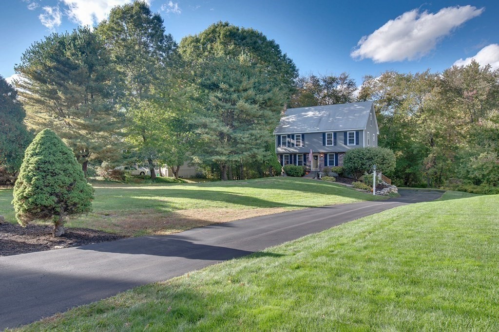 6 Peach Tree Path Andover, MA 01810 - Photo 1 of 33 a view of a tennis ground with a large trees