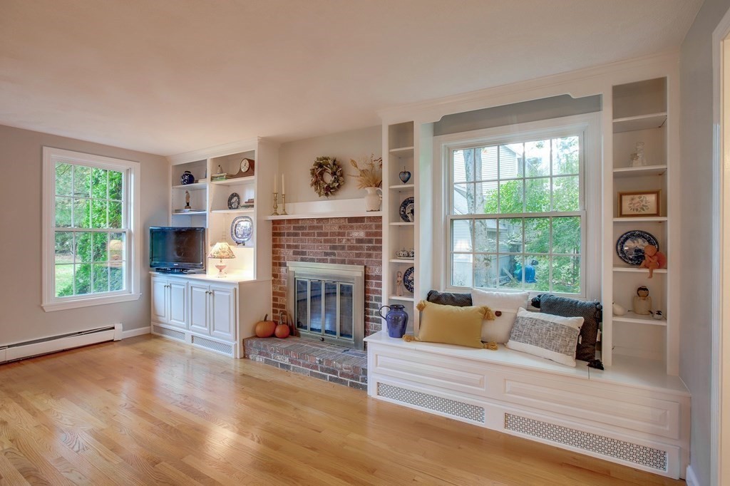 6 Peach Tree Path Andover, MA 01810 - Photo 12 of 33 a living room with furniture and a fireplace
