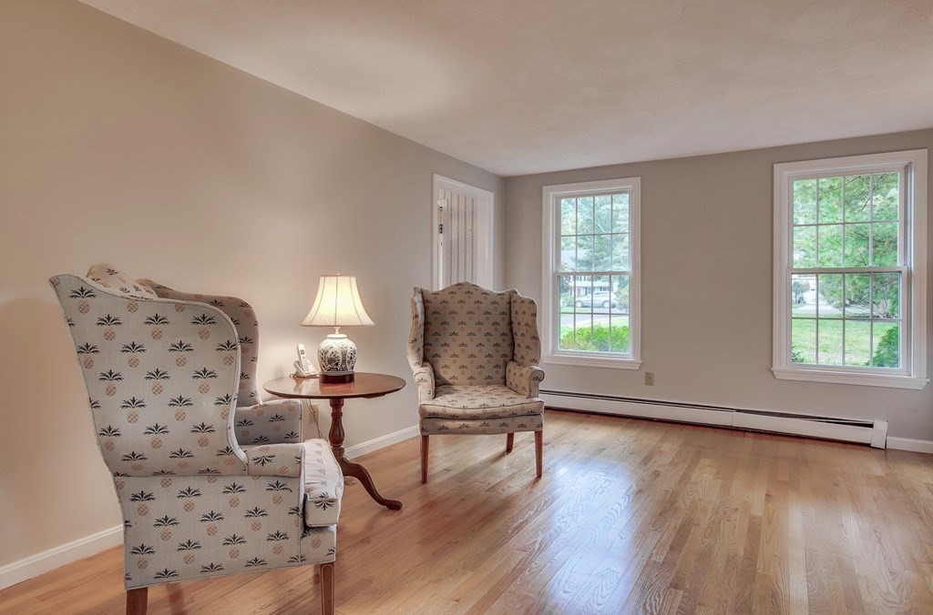 6 Peach Tree Path Andover, MA 01810 - Photo 13 of 33 a living room with furniture and a large window