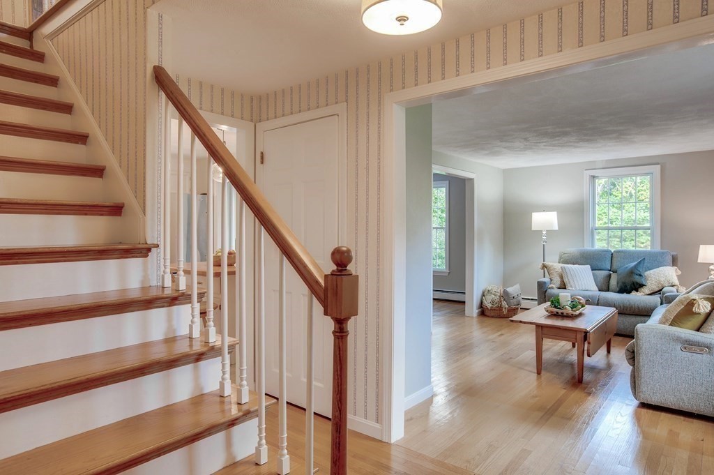 6 Peach Tree Path Andover, MA 01810 - Photo 16 of 33 a view of entryway and hall with wooden floor