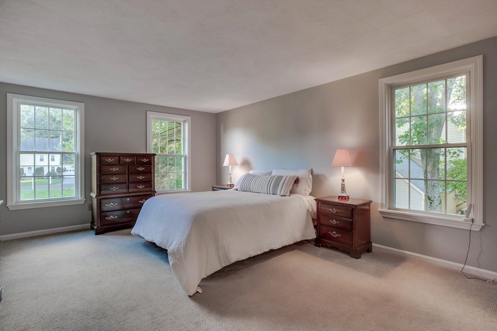 6 Peach Tree Path Andover, MA 01810 - Photo 22 of 33 a spacious bedroom with a bed and a window