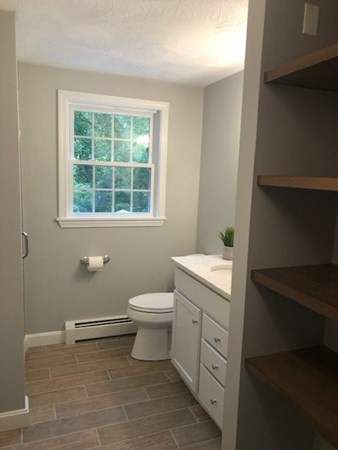 6 Peach Tree Path Andover, MA 01810 - Photo 31 of 33 a bathroom with a toilet sink and window