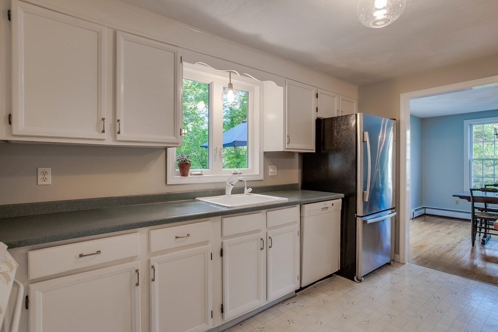 6 Peach Tree Path Andover, MA 01810 - Photo 9 of 33 a kitchen with appliances cabinets and a sink
