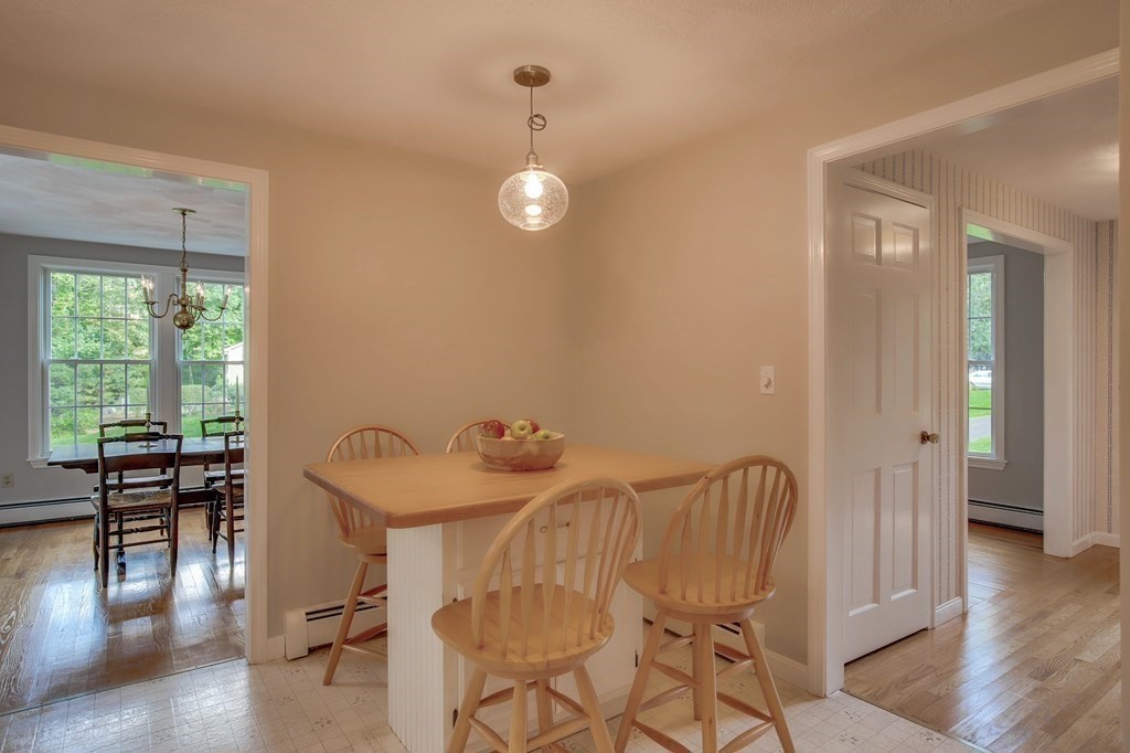 6 Peach Tree Path Andover, MA 01810 - Photo 10 of 33 a view of a dining room with furniture wooden floor and chandelier
