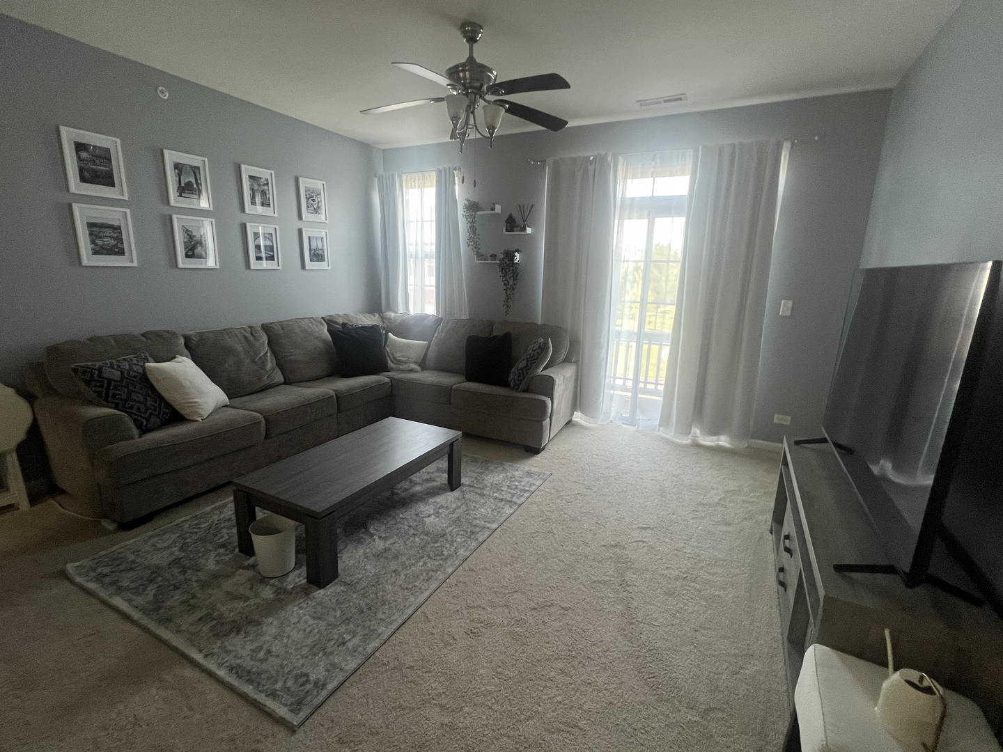 10205 Mulberry Lane, Unit J Bridgeview, IL 60455 - Photo 3 of 12 a living room with furniture and a flat screen tv