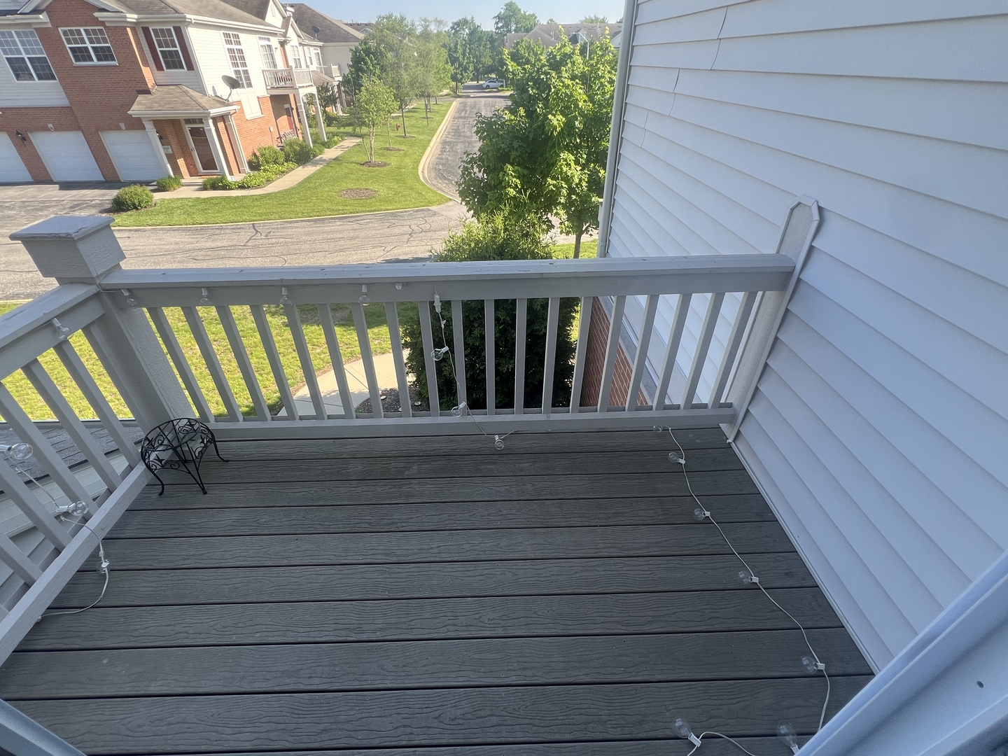 10205 Mulberry Lane, Unit J Bridgeview, IL 60455 - Photo 4 of 12 a view of a balcony with wooden floor