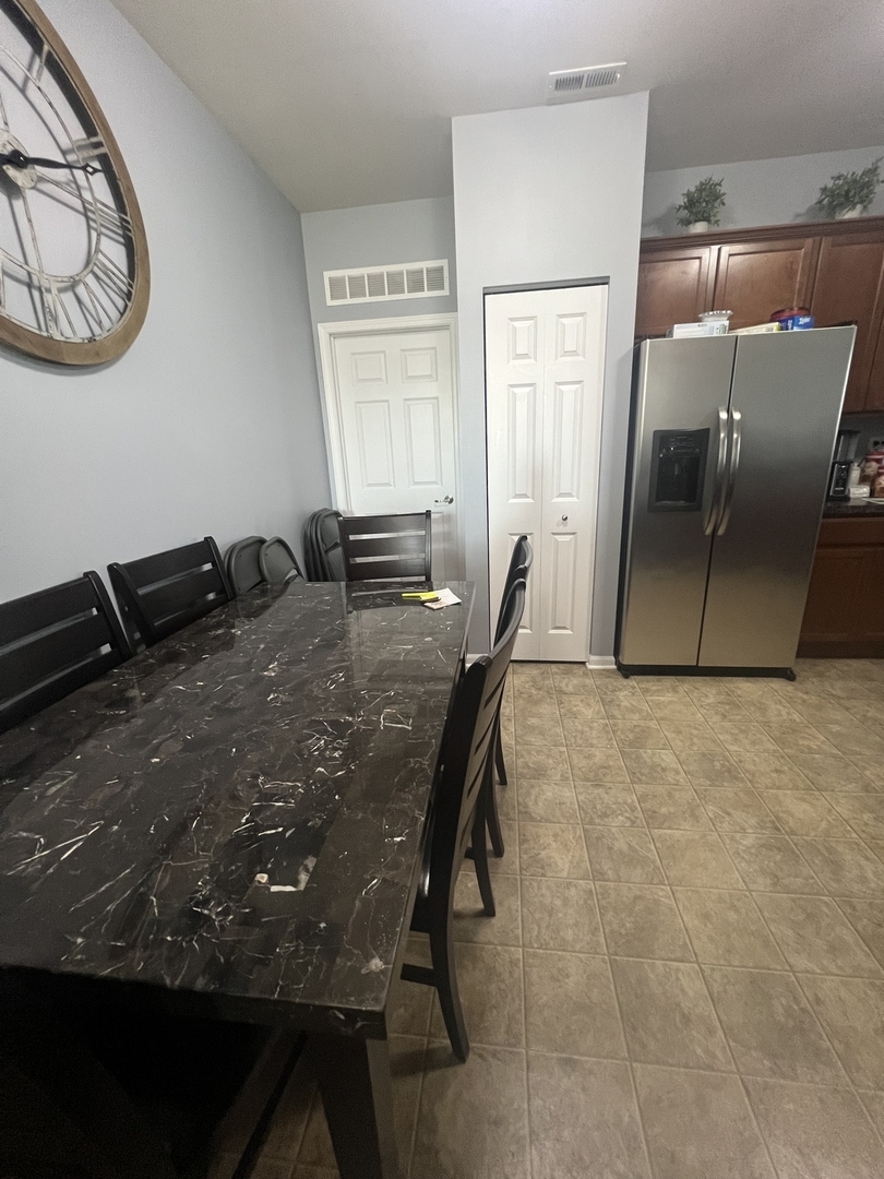 10205 Mulberry Lane, Unit J Bridgeview, IL 60455 - Photo 8 of 12 a view of a dining room with furniture