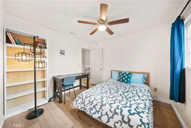 a bedroom with a bed and a cabinets