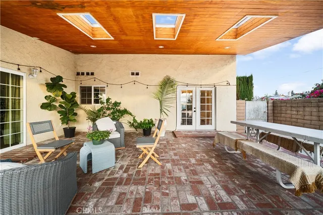 a view of a chairs and table in a patio