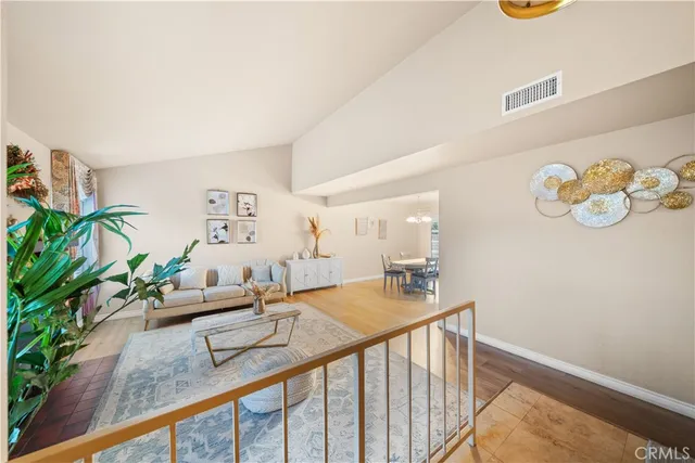 a hallway with a dining table and chairs