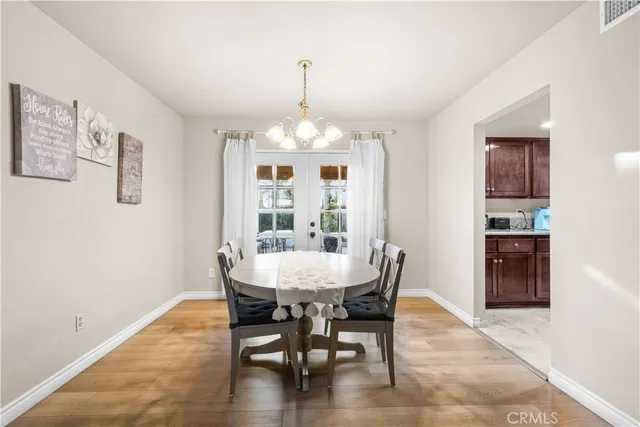 a view of a dining room with furniture and window