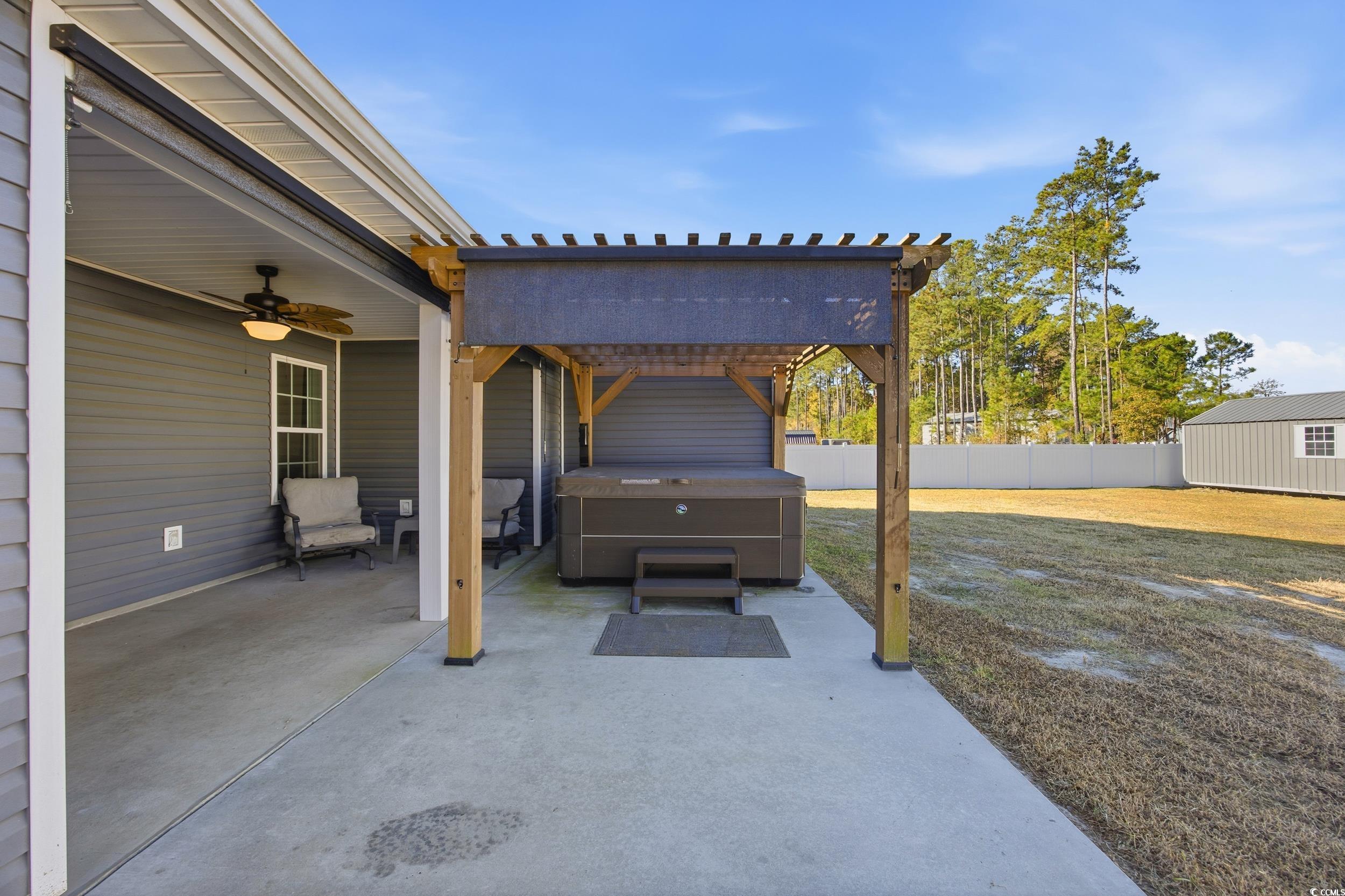 2295 Vaught Road Galivants Ferry, SC 29544 - Photo 18 of 26 View of patio featuring a hot tub, a pergola, and a ceiling fan