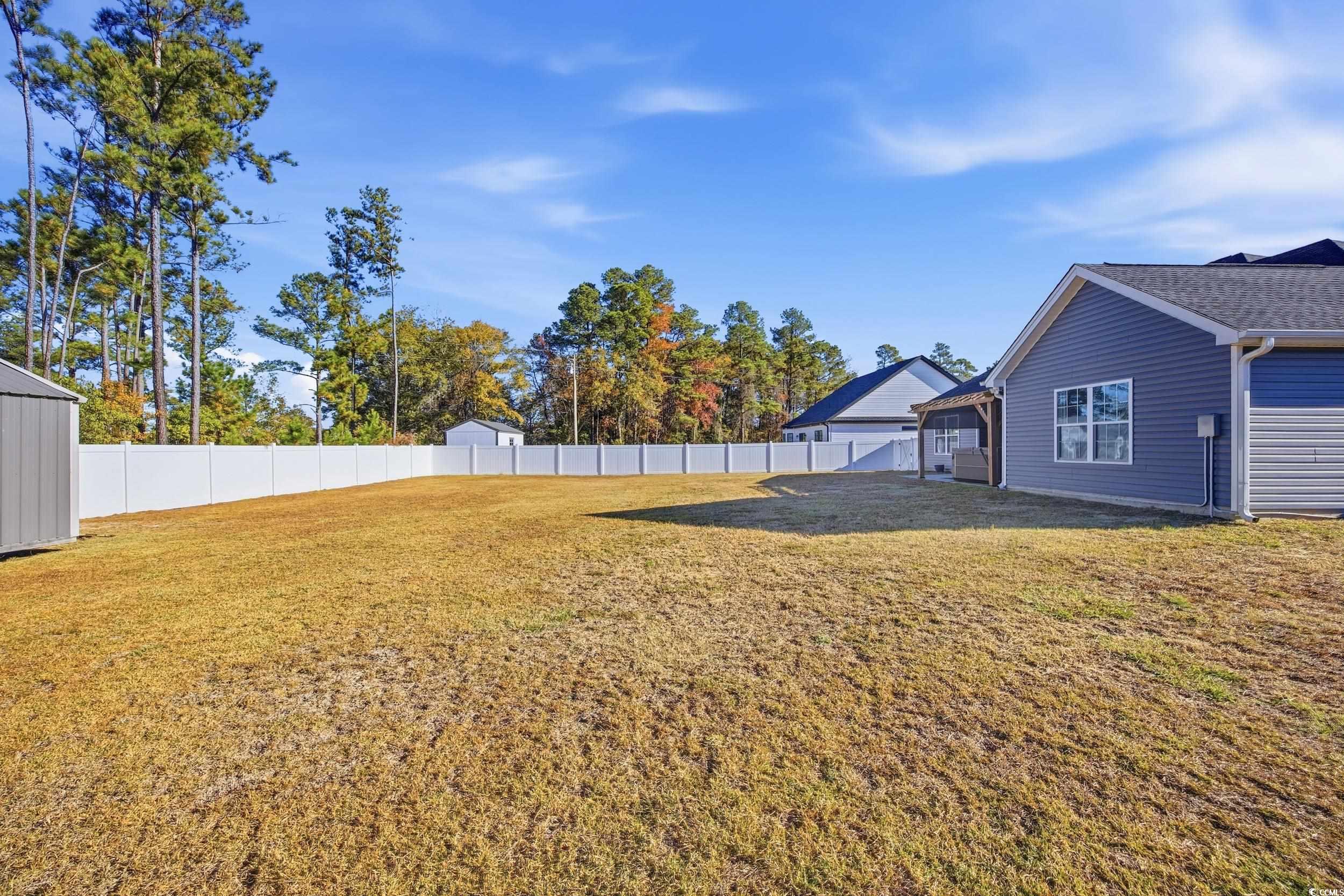 2295 Vaught Road Galivants Ferry, SC 29544 - Photo 19 of 26 Fenced backyard with a patio area