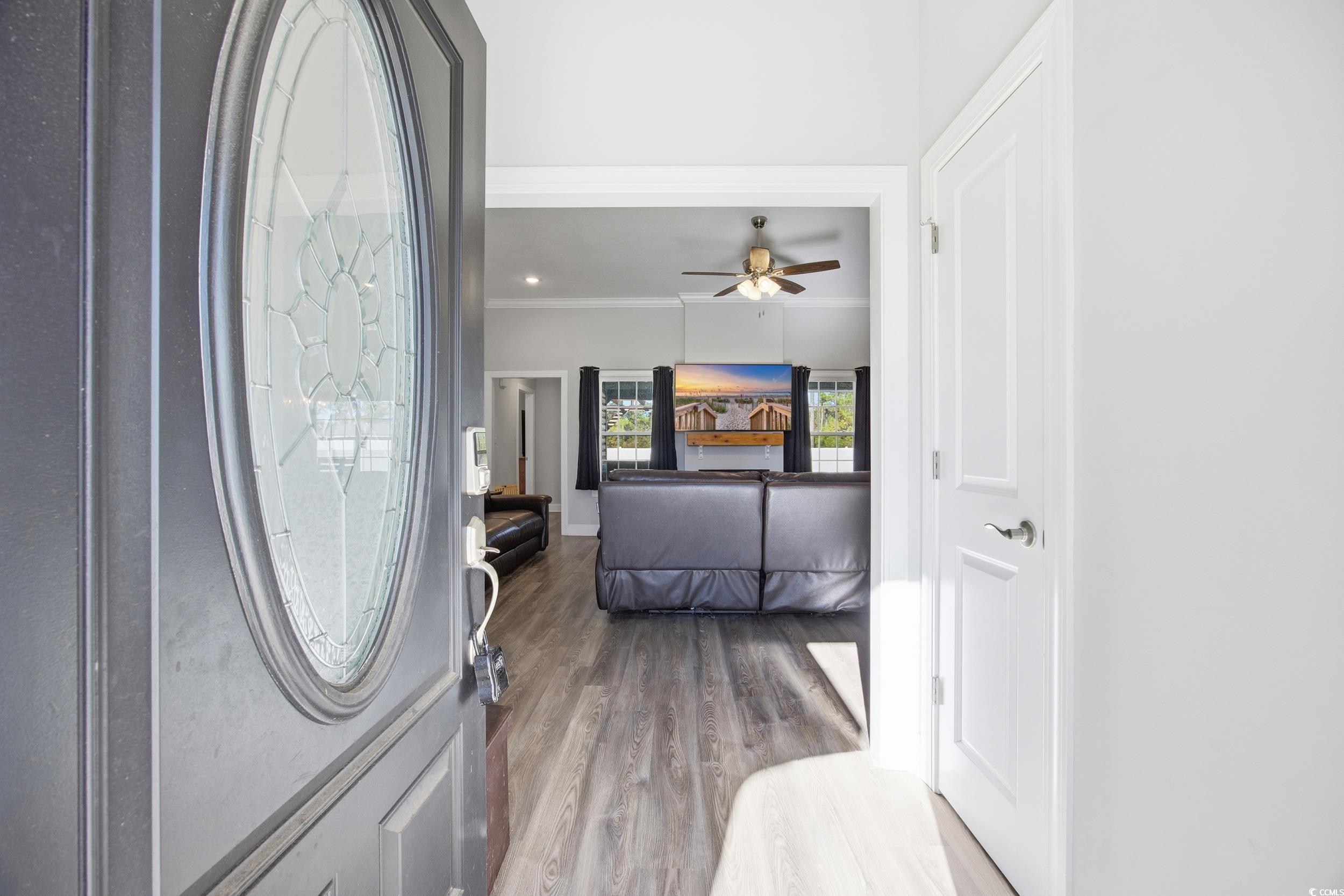 2295 Vaught Road Galivants Ferry, SC 29544 - Photo 4 of 26 Entrance foyer with wood finished floors, ceiling fan, and ornamental molding