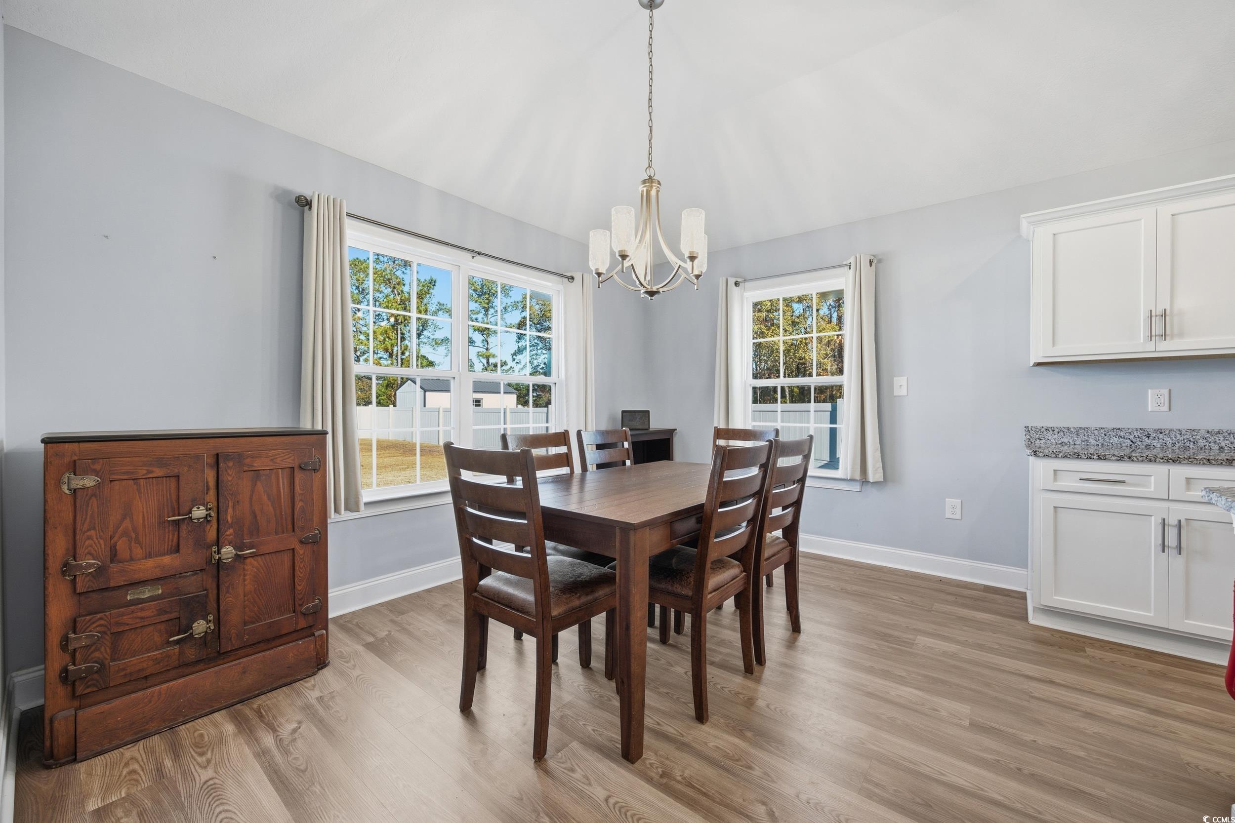 2295 Vaught Road Galivants Ferry, SC 29544 - Photo 8 of 26 Dining space with light wood-style flooring and a chandelier
