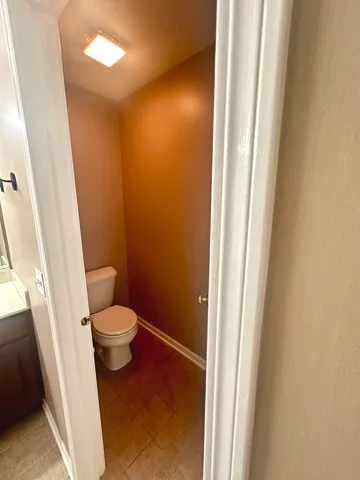 a bathroom with a toilet and a sink