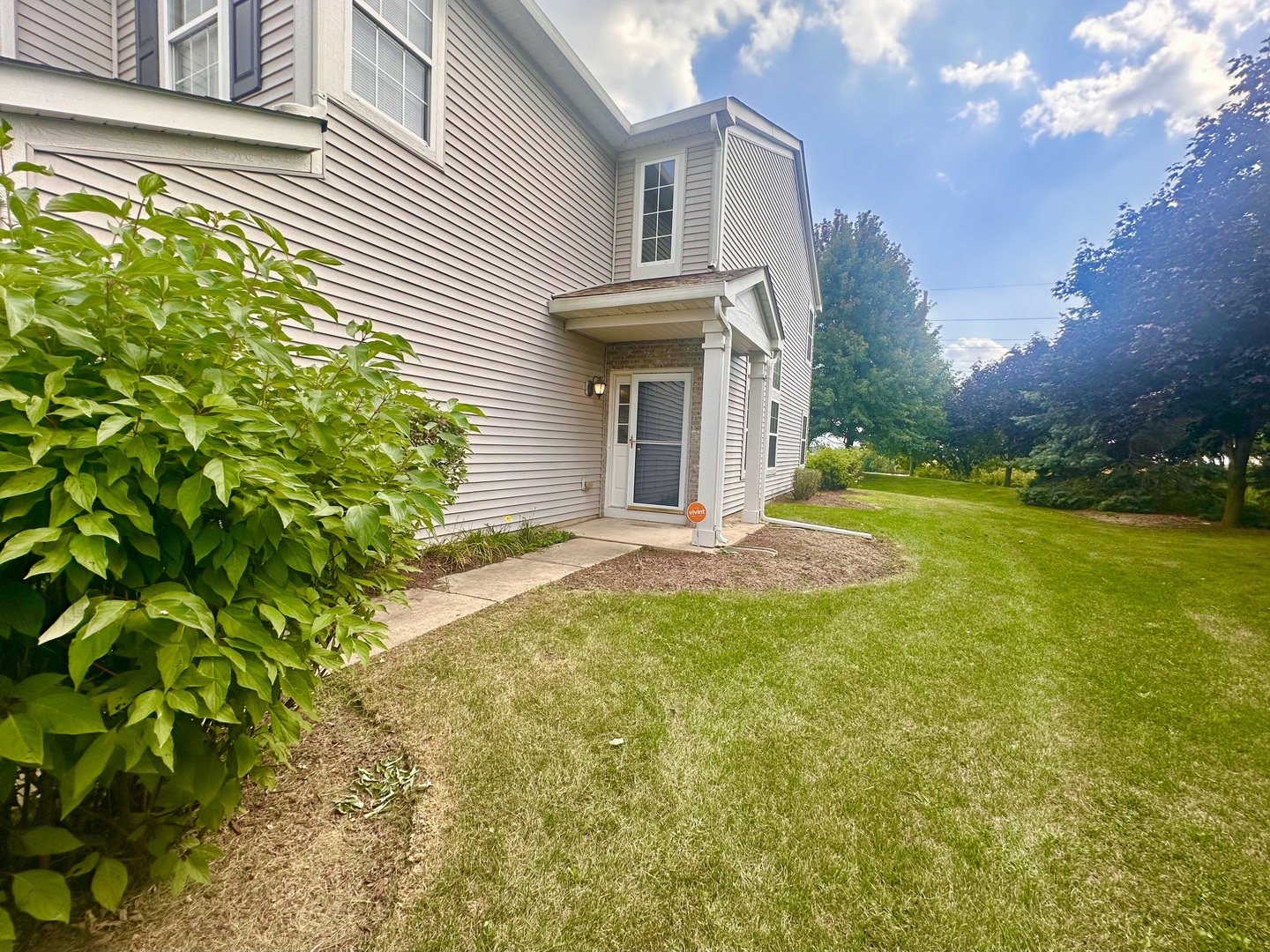 1850 Candlelight Circle Montgomery, IL 60538 - Photo 2 of 29 a view of a house with pool and garden
