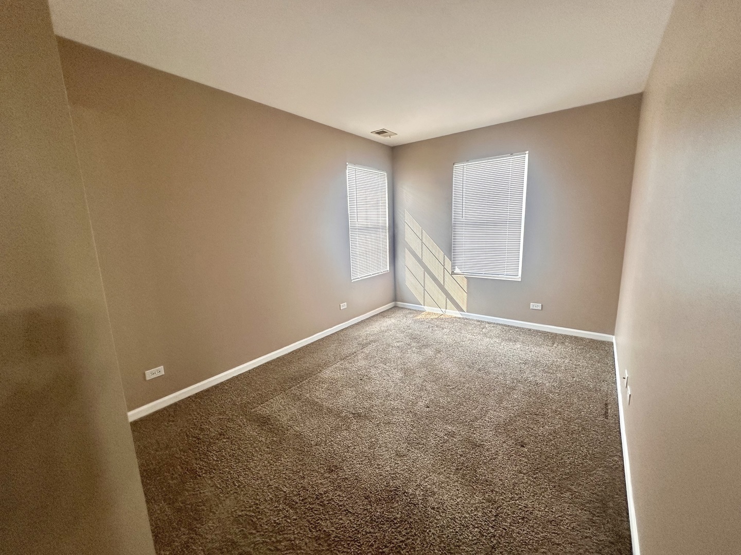 1850 Candlelight Circle Montgomery, IL 60538 - Photo 21 of 29 an empty room with an empty space and windows