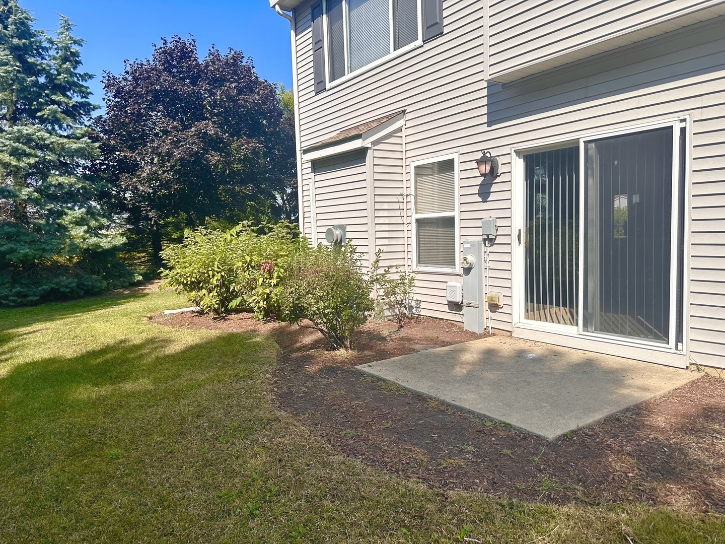 1850 Candlelight Circle Montgomery, IL 60538 - Photo 28 of 29 a front view of a house with a yard and garage