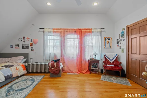 a bedroom with two beds and a window