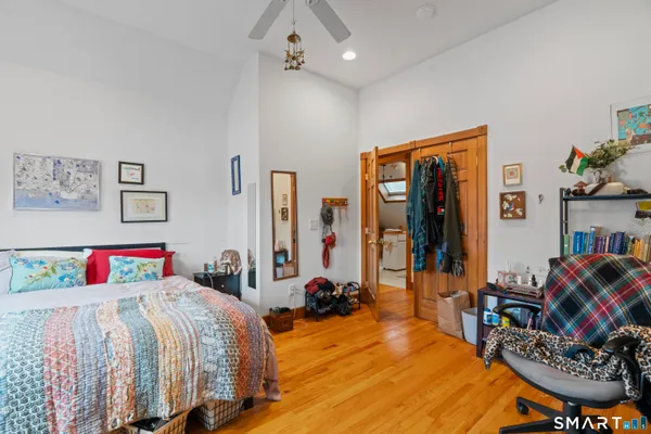 a bedroom with bed and furniture